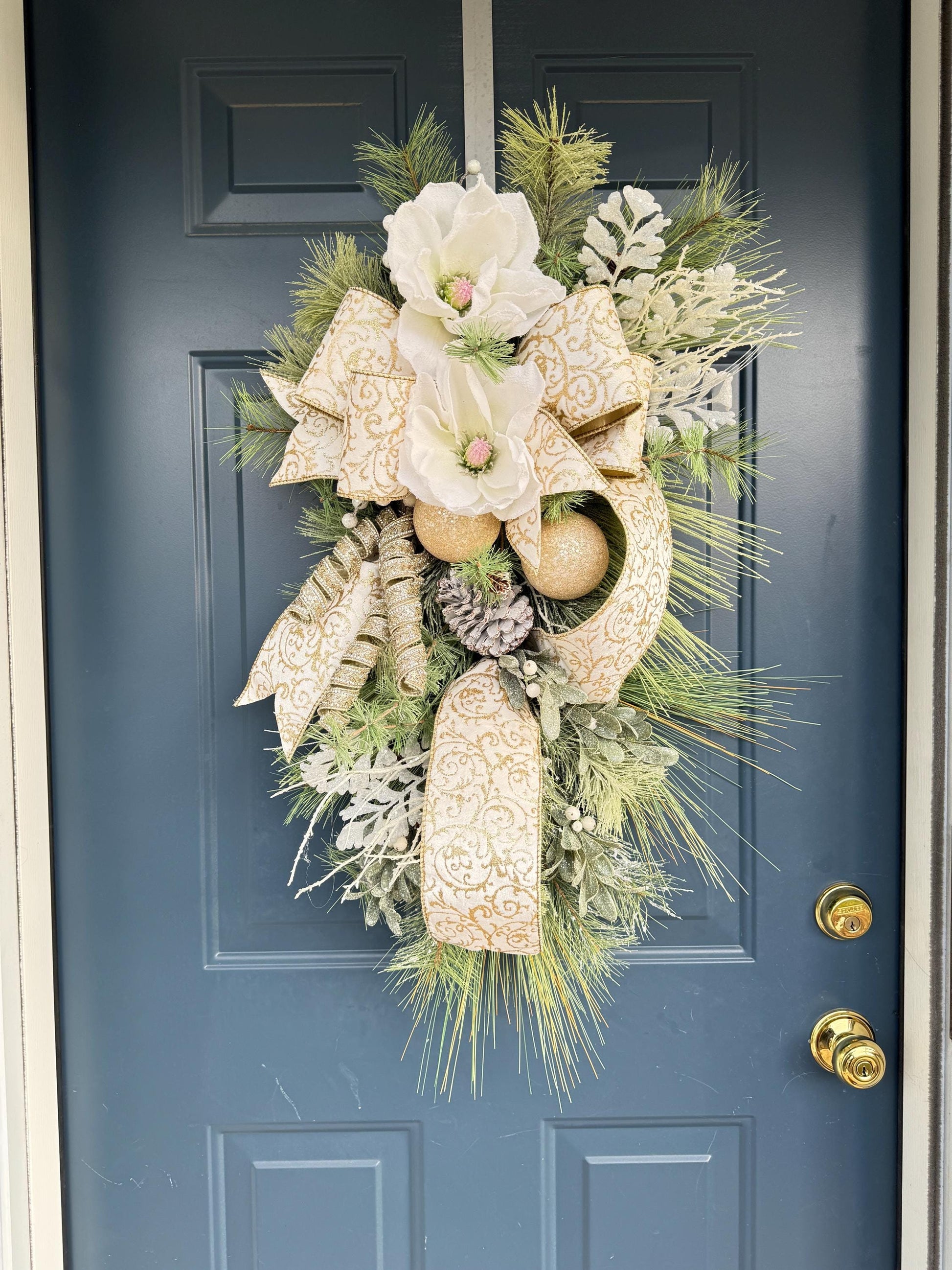 white and gold snowy magnolia wreath swag